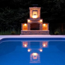 Mirror Lighting At An Inground Pool With A Beautiful Fireplace Outdoor Chimney In Somers CT